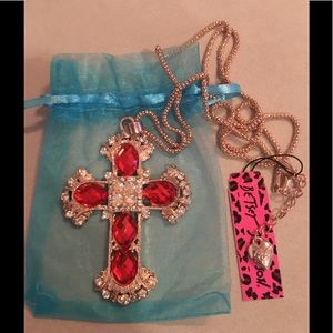 Betsy Johnson’s rhinestoned cross with necklace